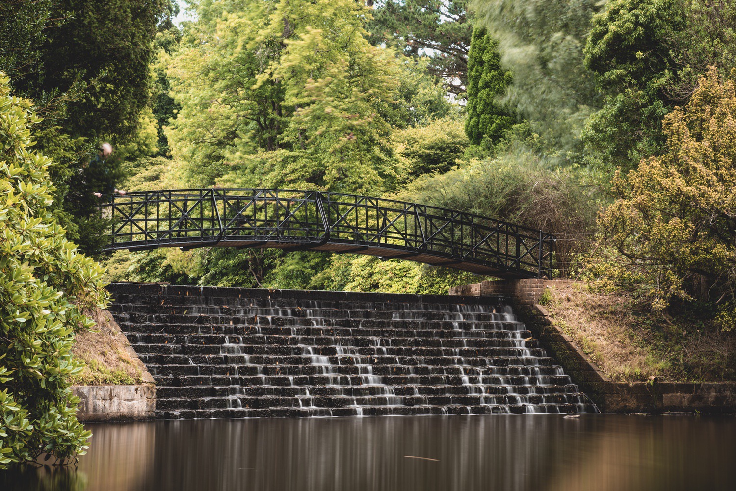 Waterfall and bridge down to the lower lake