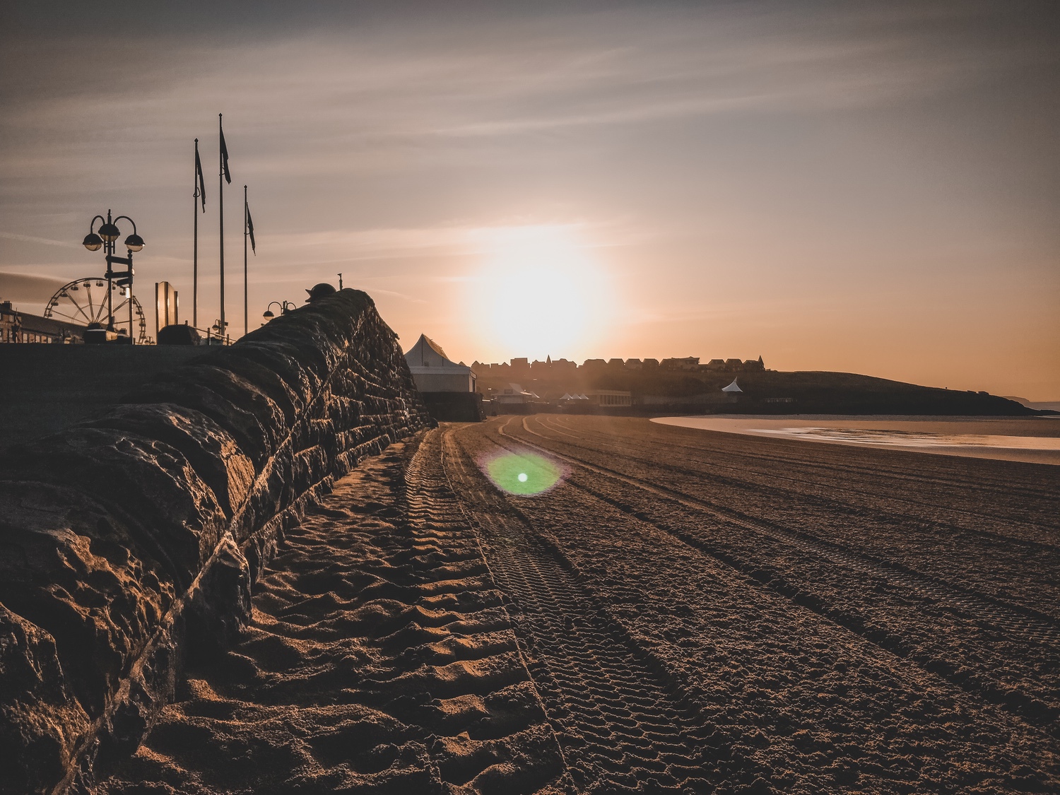 The freshly raked beach sand