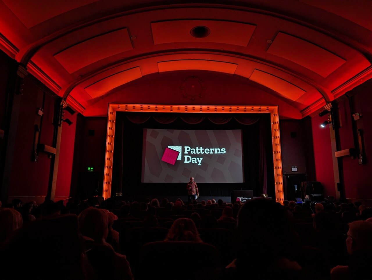 A wide angle photo taken from the audience in the Duke of York’s Picturehouse. Jeremy Keith is on the stage opening the conference.